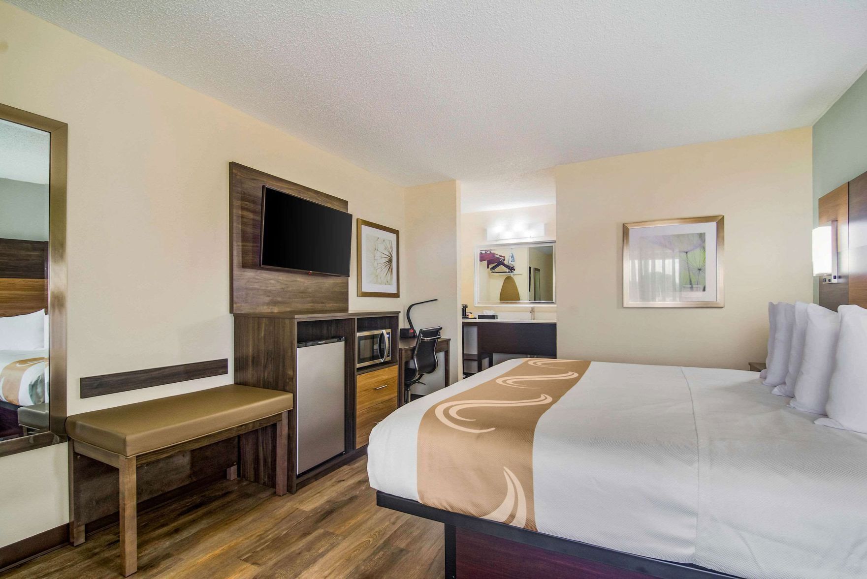 Premium bedding, desk, laptop workspace, blackout drapes