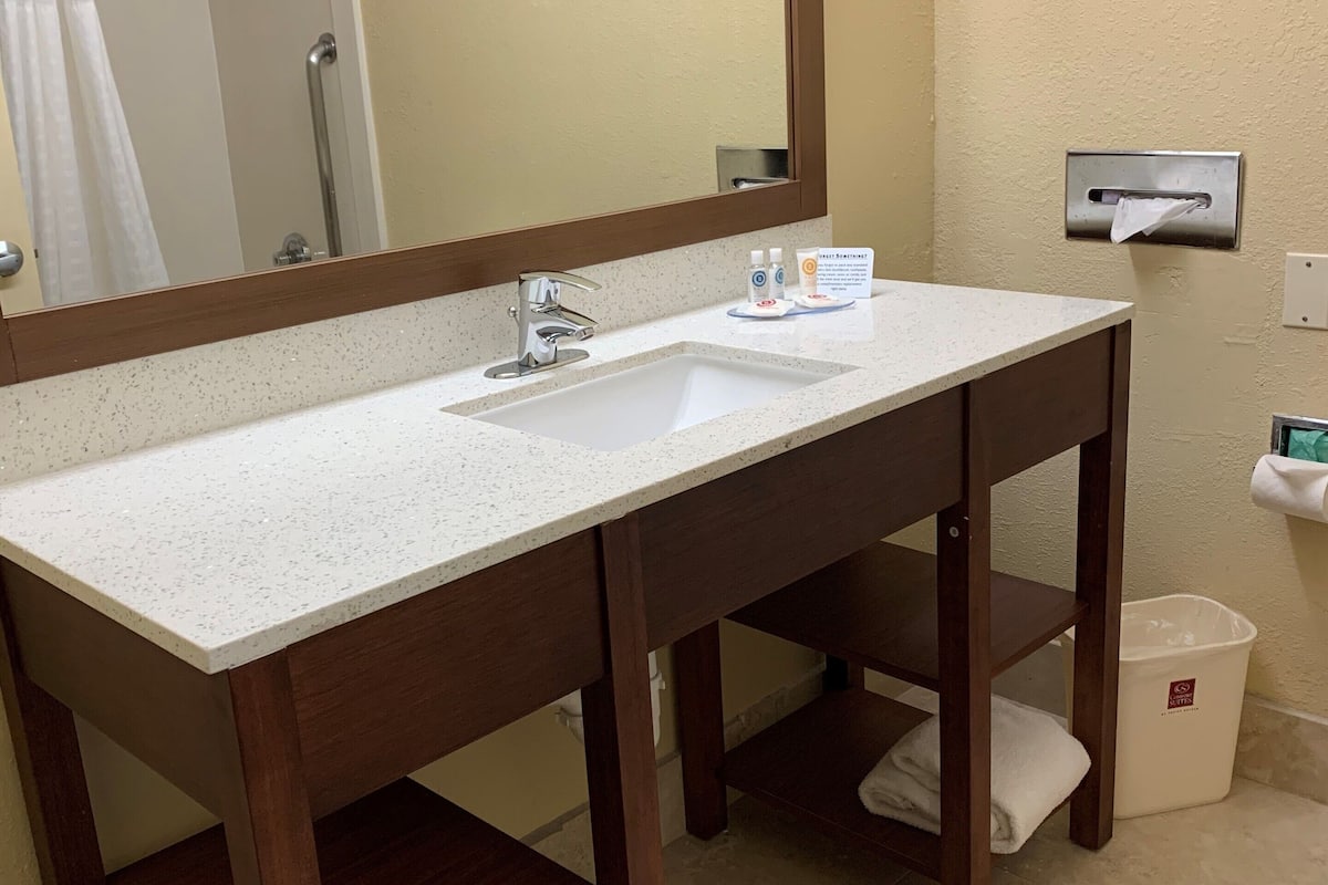 bathtub, free toiletries, hair dryer, towels