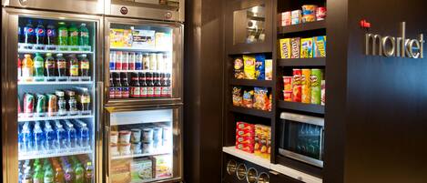 A vending machine area with various snacks and drinks.