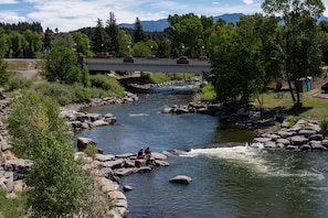 A river with rocks and a bridge in the background. - HillSide Inn (Pagosa Springs)