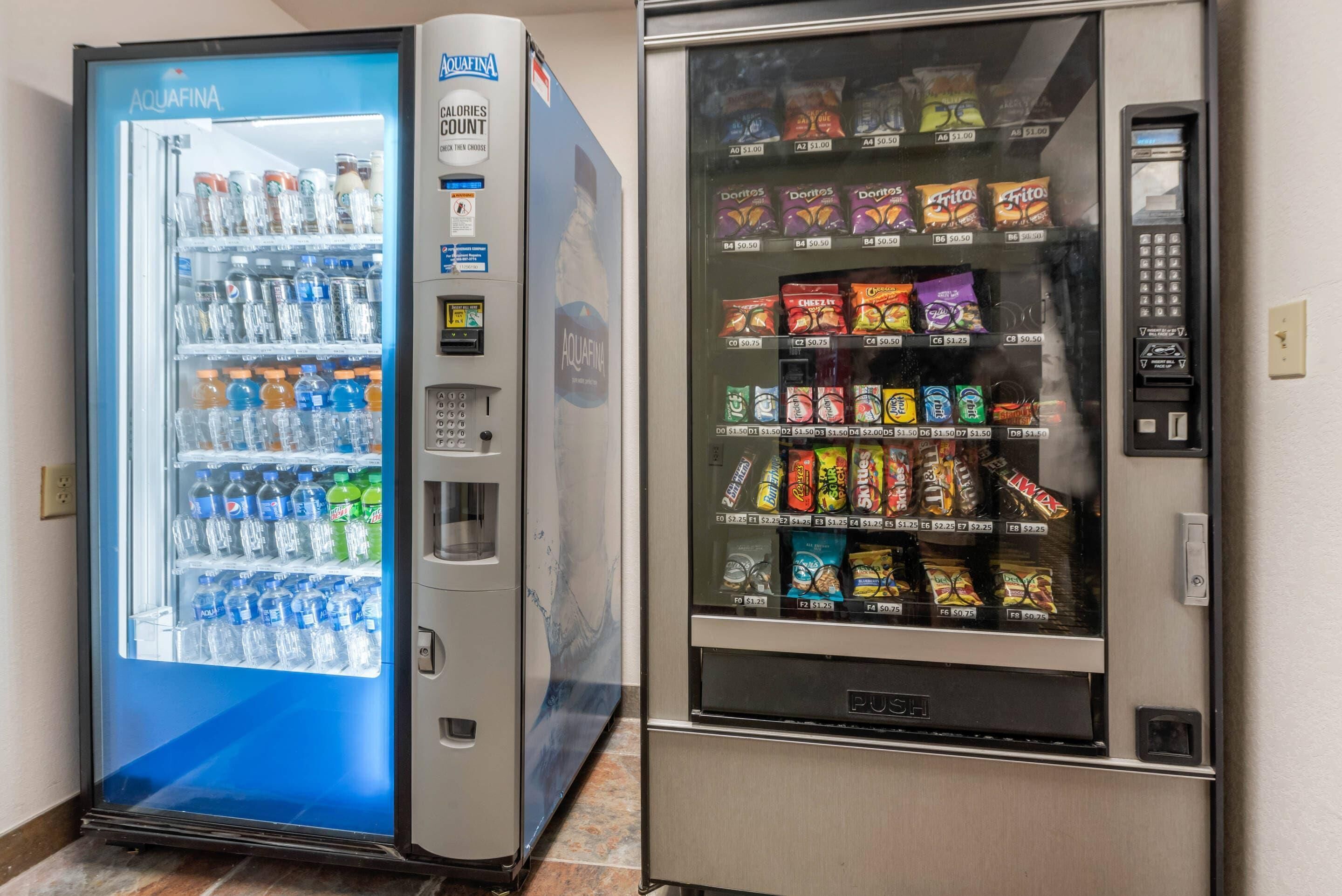 A vending machine with a blue exterior and a refrigerated drink dispenser.