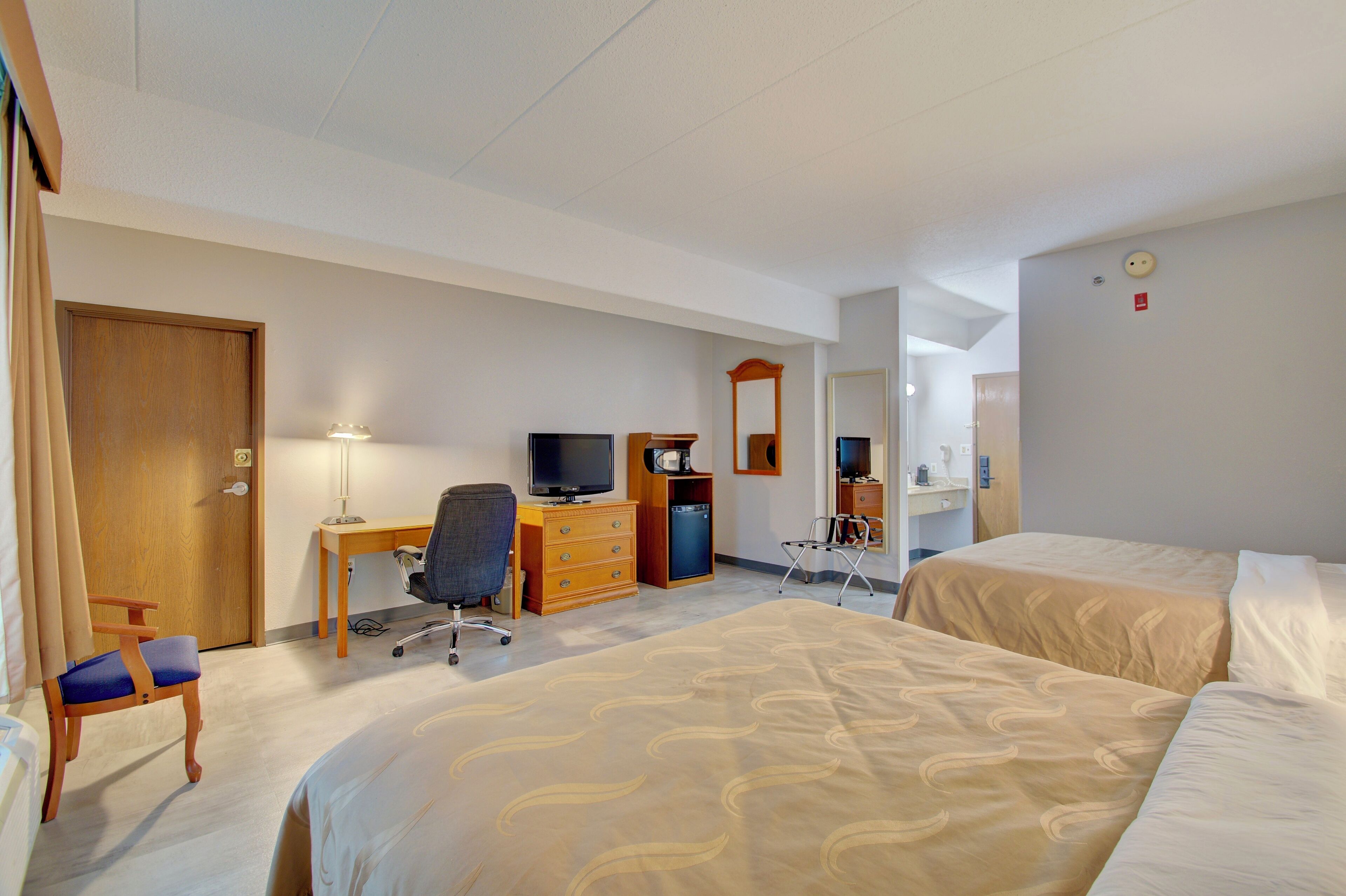standard room, 2 queen beds, non smoking | premium bedding, laptop workspace, soundproofing, iron/ironing board