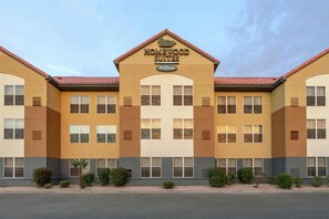 A hotel with a 'Homewood Suites' sign, multiple windows, and a red-tiled roof. - Homewood Suites by Hilton Phoenix/Chandler (Chandler)