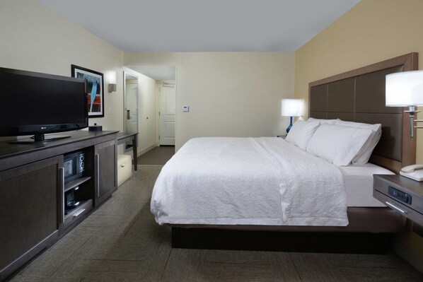 Premium bedding, desk, laptop workspace, blackout curtains