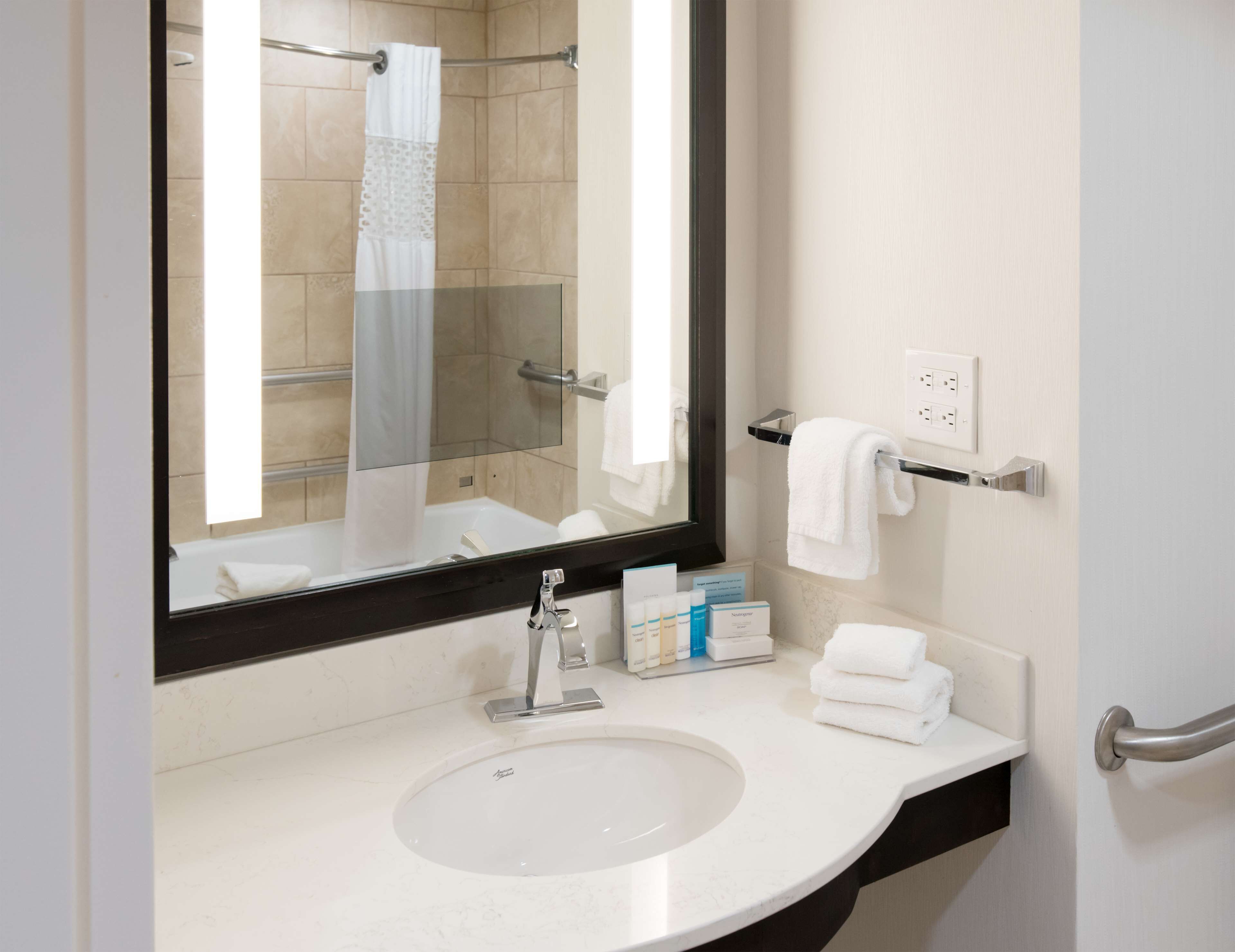 combined shower/bathtub, designer toiletries, hair dryer, towels