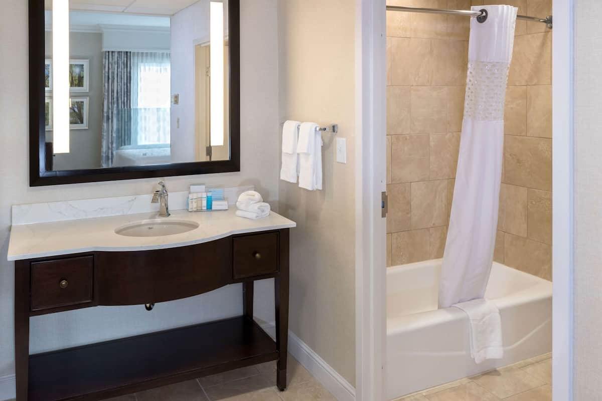 Bathroom | Combined shower/tub, designer toiletries, hair dryer, towels