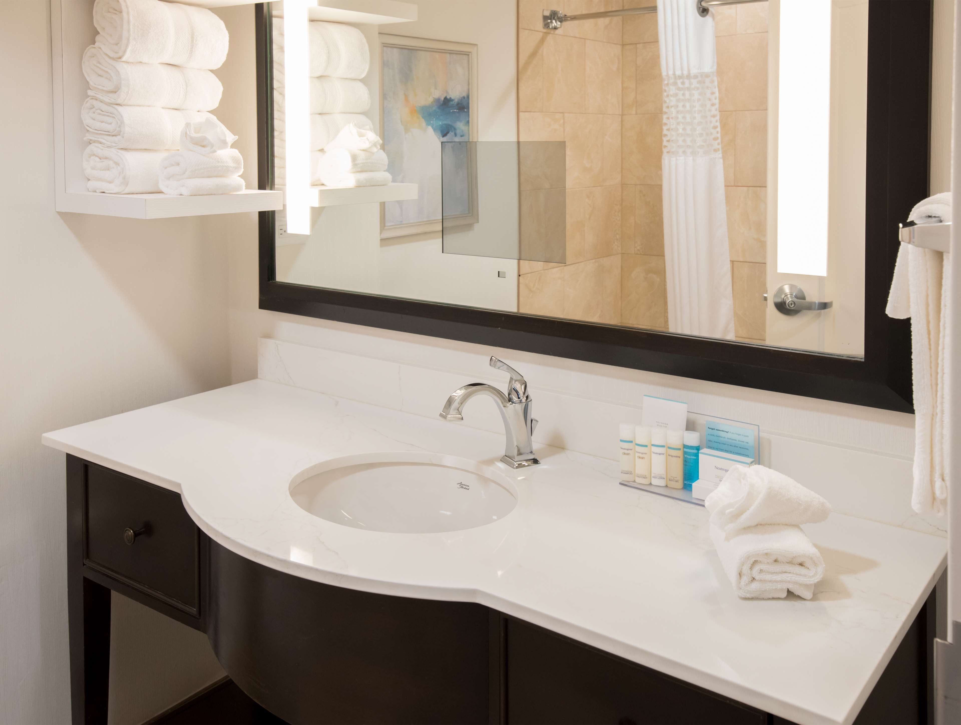 combined shower/bathtub, designer toiletries, hair dryer, towels