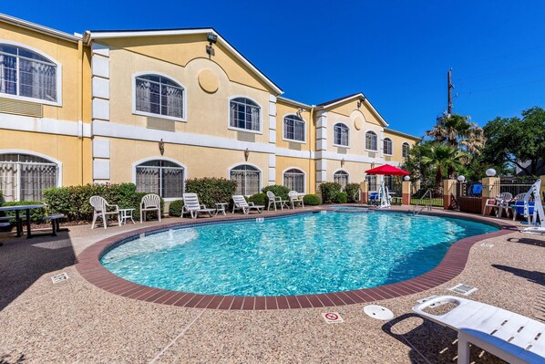 Seasonal outdoor pool, pool loungers