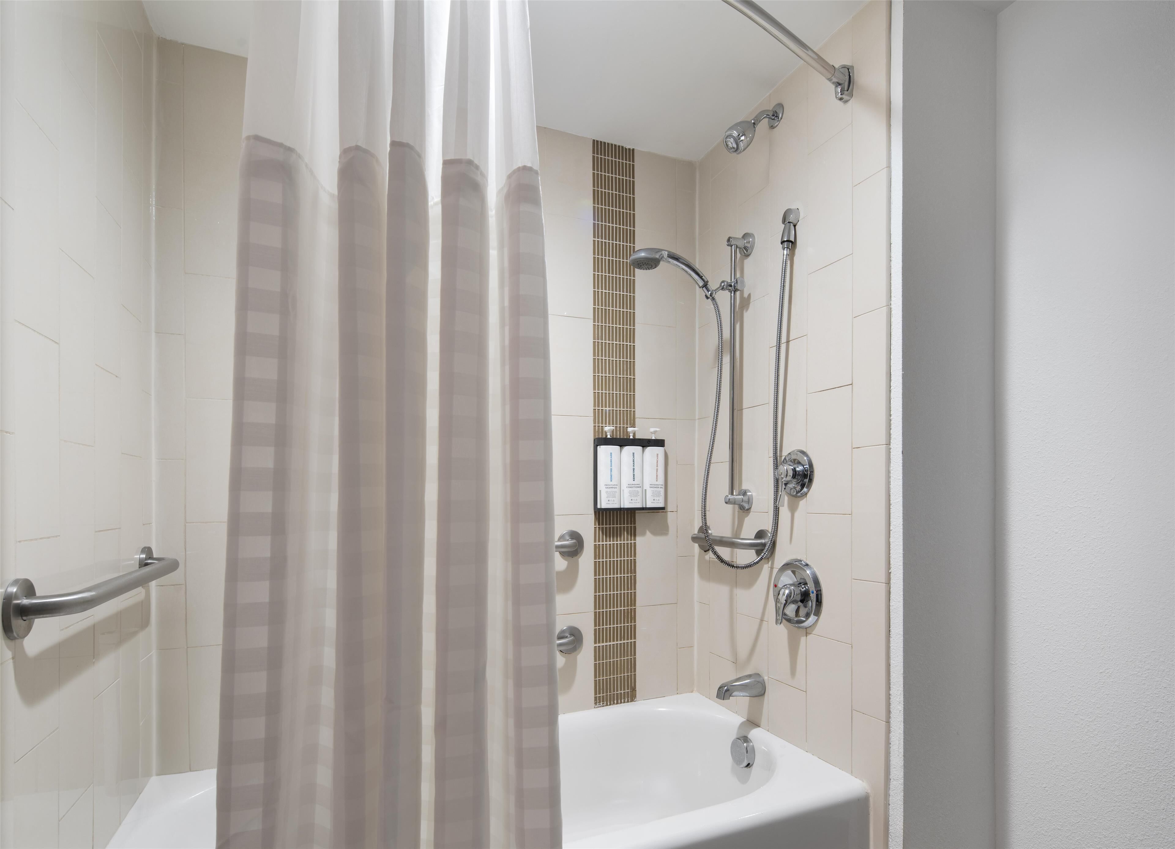 room, 1 king bed (accessible, bathtub) | bathroom | designer toiletries, hair dryer, towels, soap