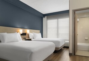 Premium bedding, down duvets, in-room safe, desk