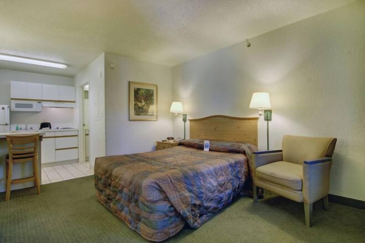 Laptop workspace, iron/ironing board, alarm clocks, bed sheets