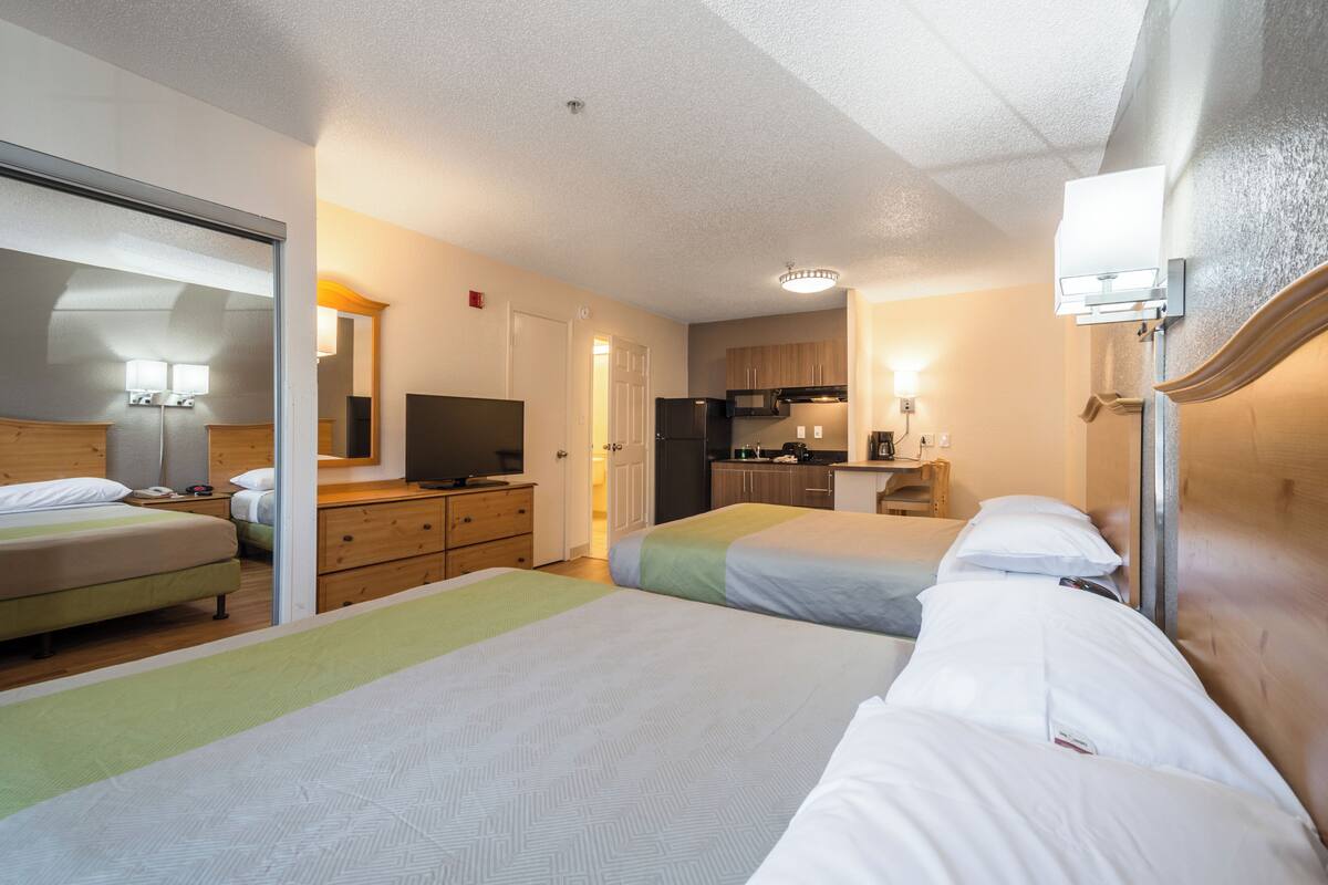 Laptop workspace, iron/ironing board, alarm clocks, bed sheets