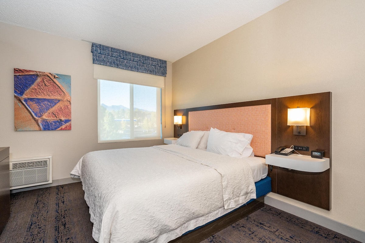 Premium bedding, blackout curtains, iron/ironing board