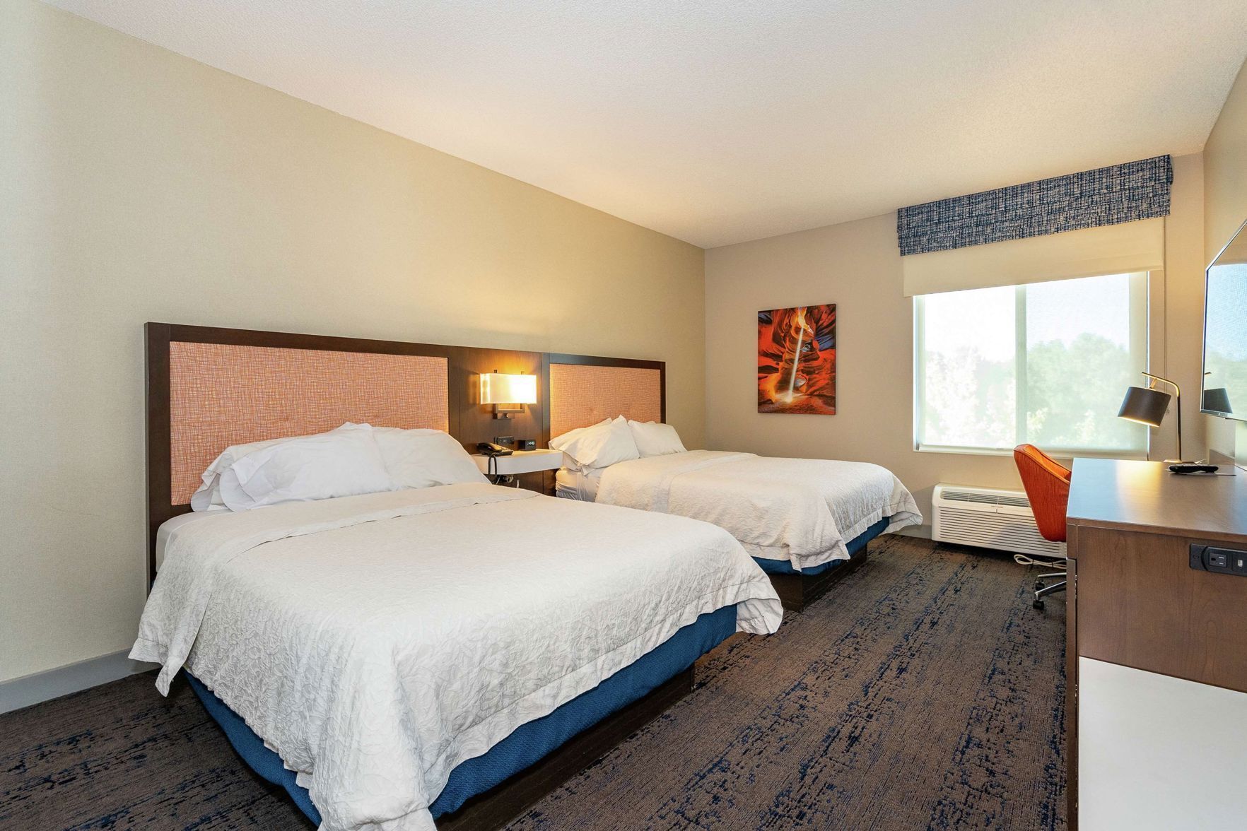 Premium bedding, blackout curtains, iron/ironing board