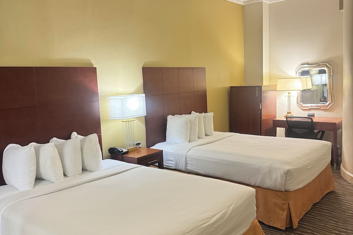 Standard Room, 2 Queen Beds, No Windows | In-room safe, desk, laptop workspace, blackout drapes
