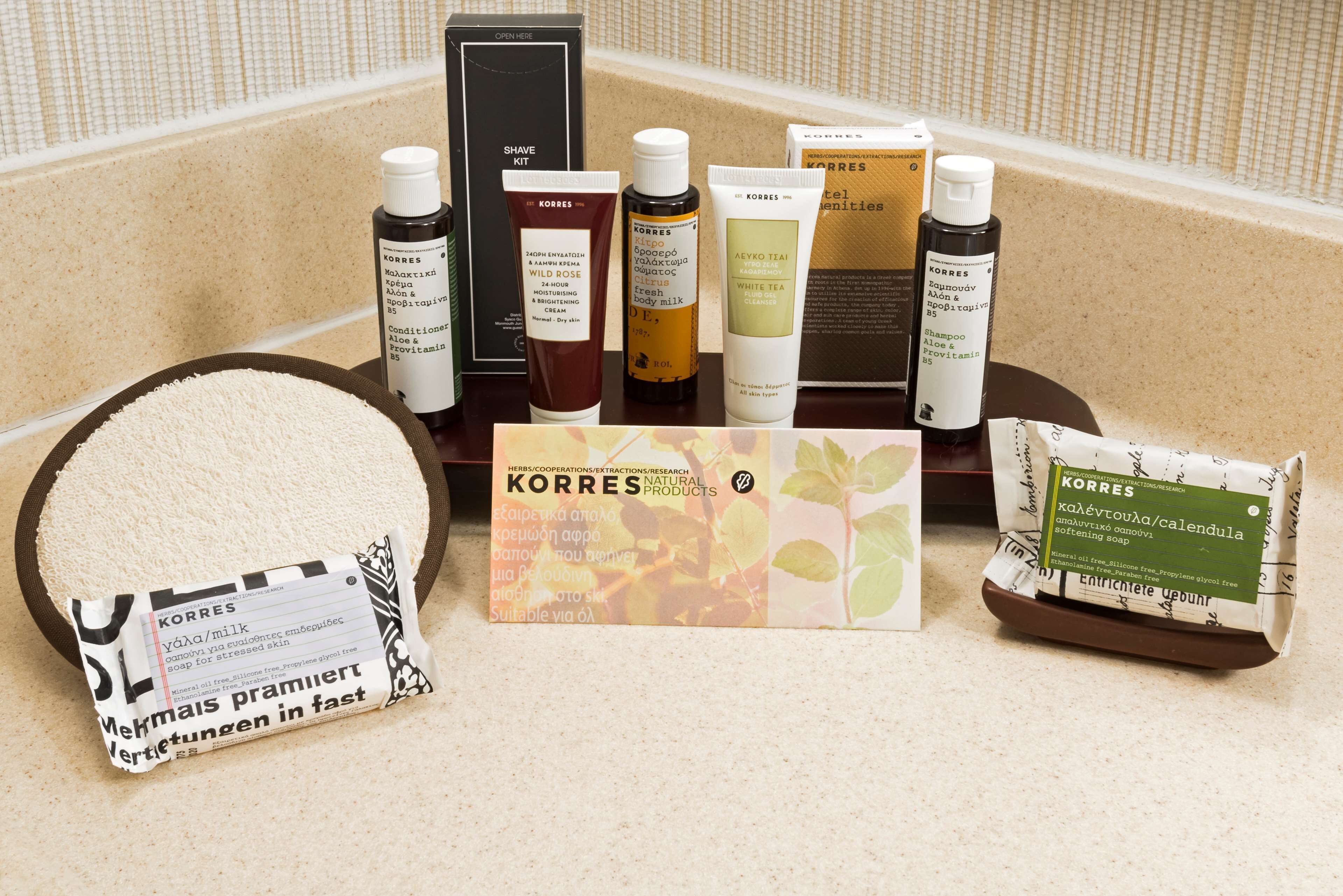 combined shower/bathtub, designer toiletries, hair dryer, towels