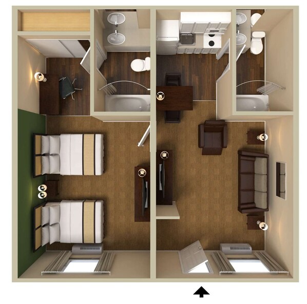 Habitación de hotel con cama, escritorio, silla, sofá, baño con inodoro y lavamanos, y ducha.