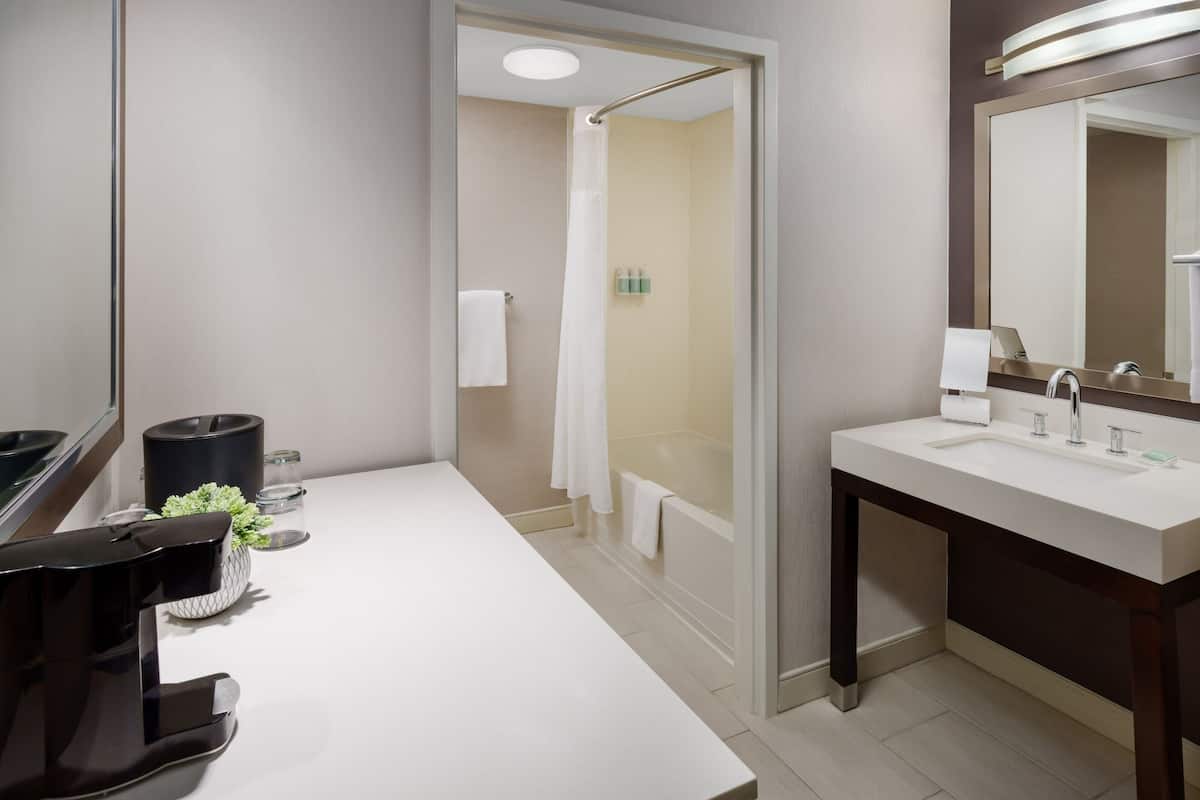 room, 2 queen beds | bathroom | combined shower/bathtub, hair dryer, towels