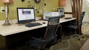 A hotel room with a desk, two computers, a printer, a lamp, and a chair. - Hampton Inn Franklin (Franklin)