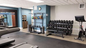 A gym with treadmills, weight racks, and exercise equipment. - Hampton Inn Kent/Akron Area (Kent)
