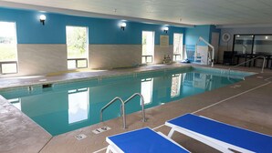 An indoor swimming pool with clear water, marked lanes, and a lifeguard station. - Hampton Inn Kent/Akron Area (Kent)
