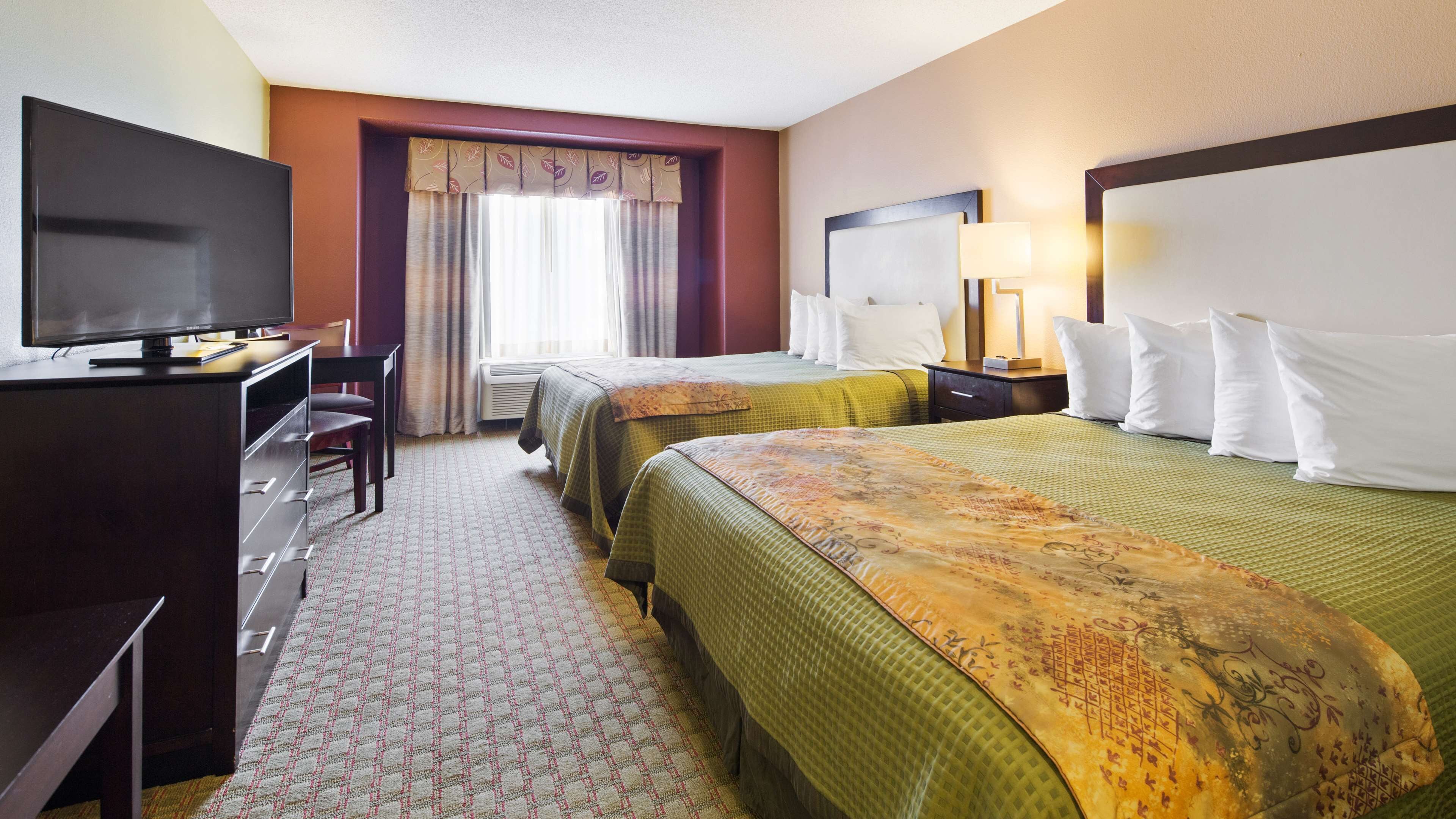 Hypo-allergenic bedding, pillowtop beds, desk, laptop workspace