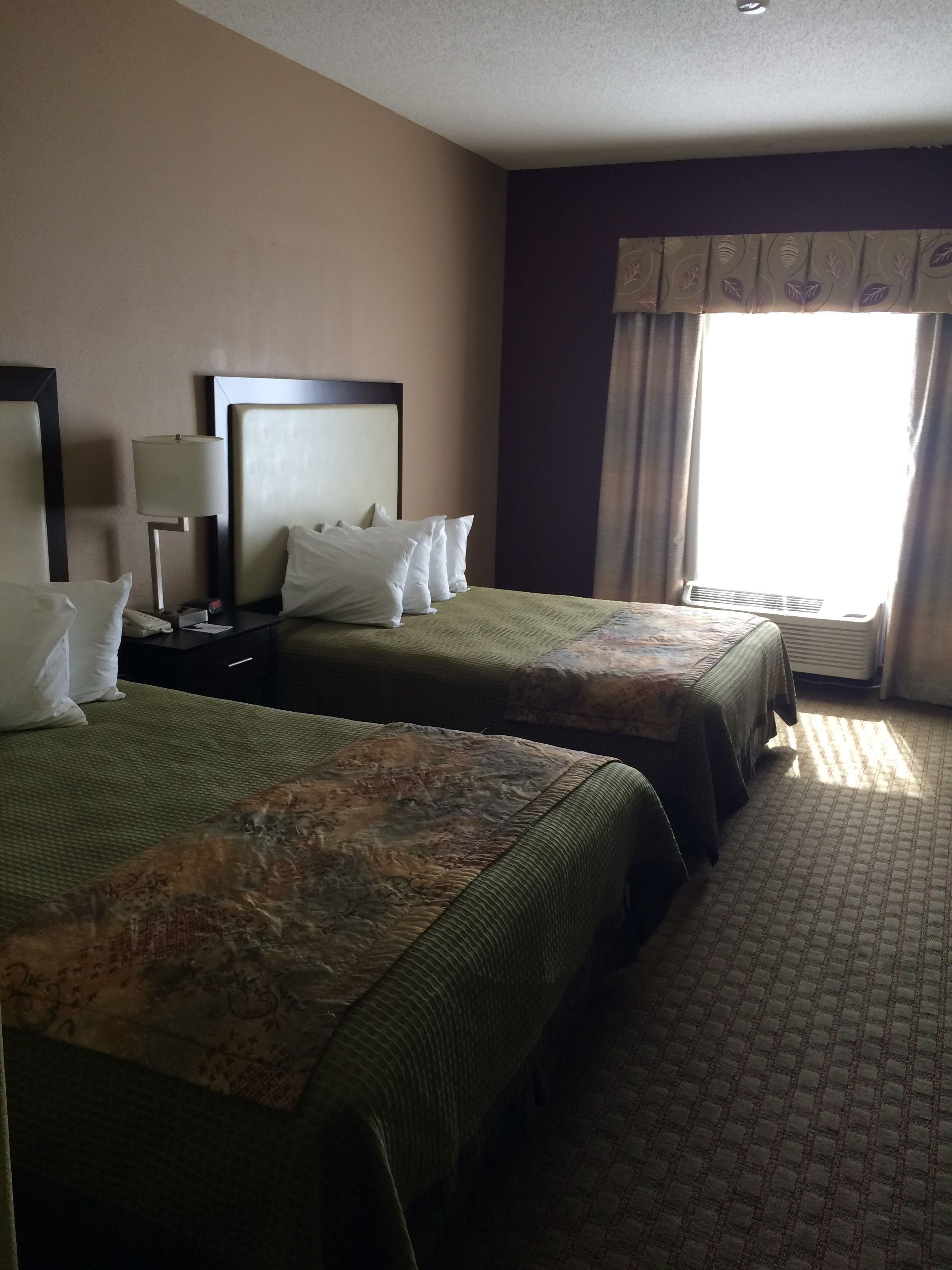 hypo-allergenic bedding, pillow-top beds, desk, laptop workspace