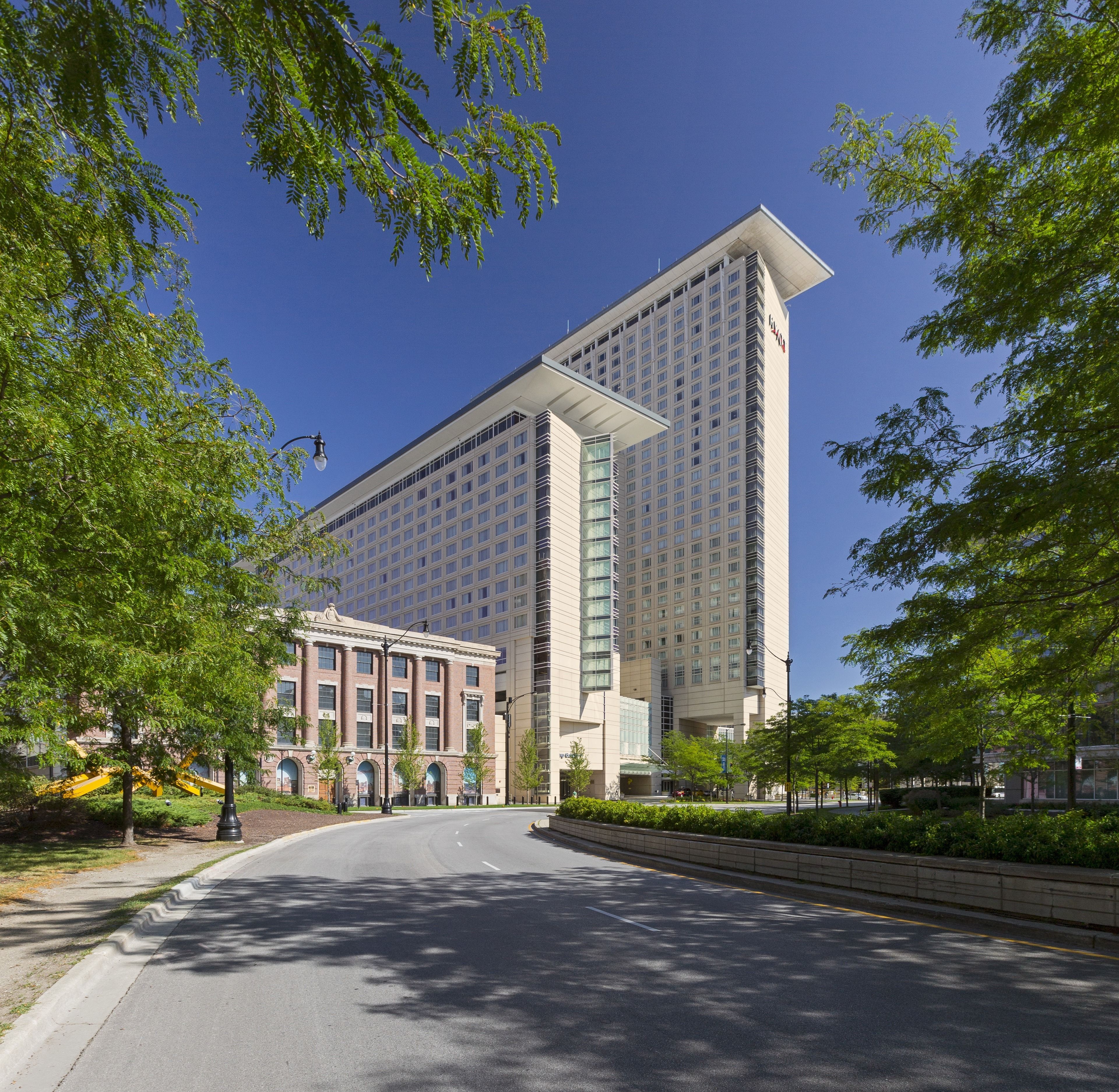 A modern hotel with a large central building and a smaller annex.