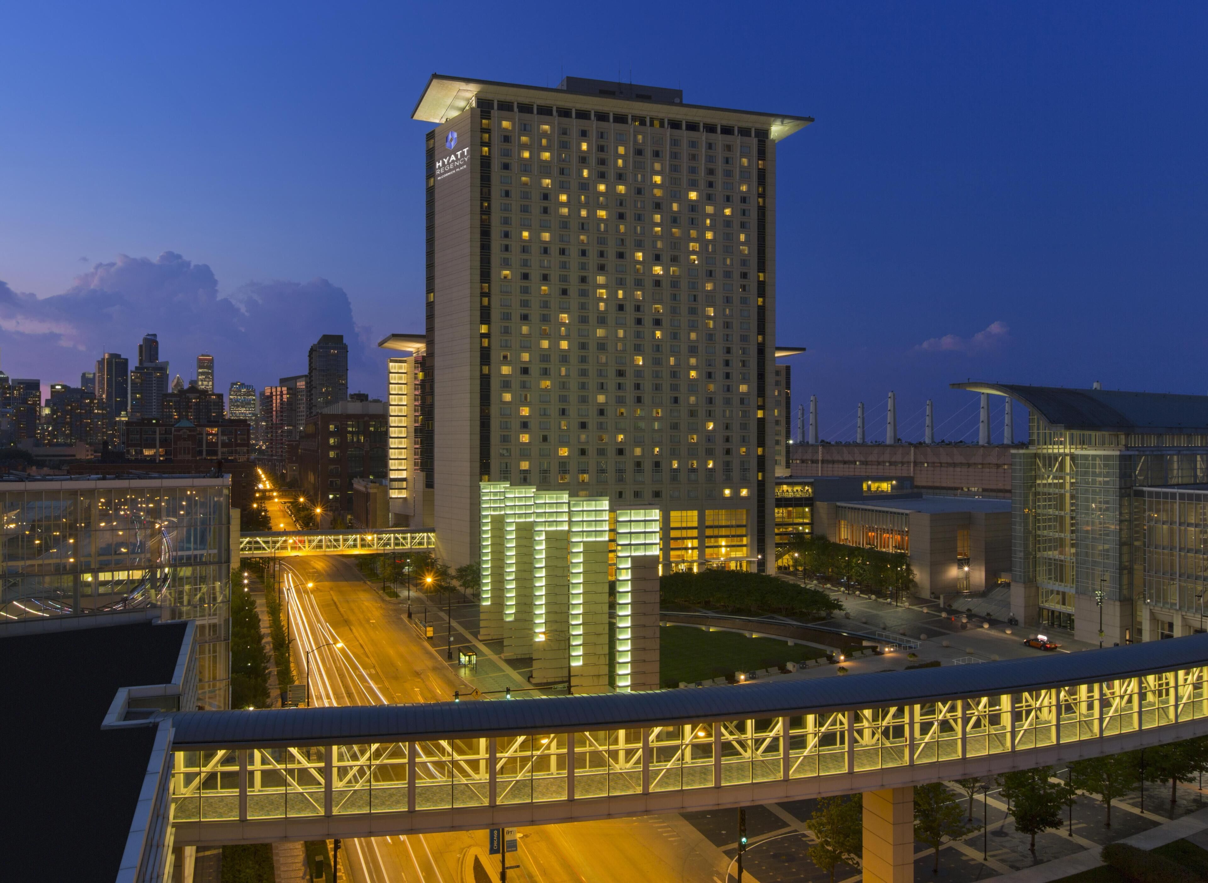 A high-rise hotel with a modern design, featuring a prominent entrance and multiple floors.
