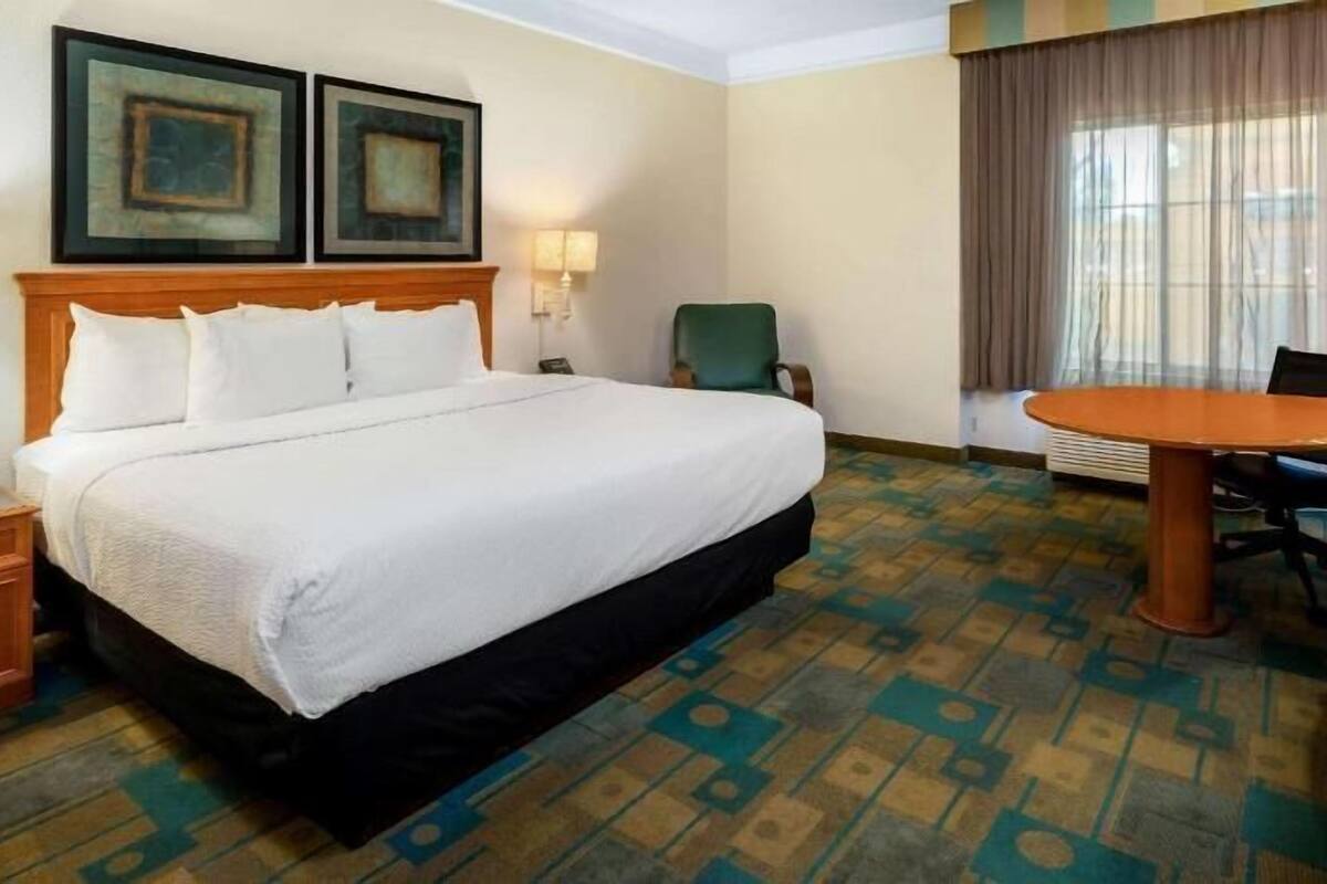 Premium bedding, desk, blackout drapes, iron/ironing board