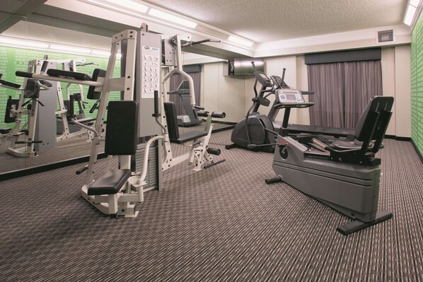 A hotel gym with various exercise equipment, including a treadmill, elliptical, and weight machines. - La Quinta Inn & Suites by Wyndham Mesa Superstition Springs (Mesa)