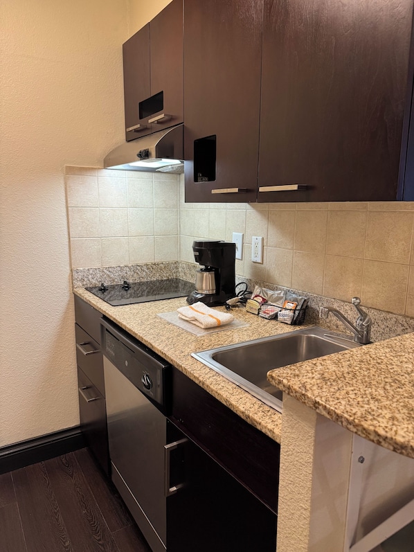 Full-size fridge, microwave, coffee/tea maker, cookware/dishes/utensils