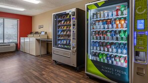 A vending area with two beverage machines, a reception desk, and a window with blinds. - Extended Stay America Suites Houston Med Ctr NRG Park Kirby (Houston)