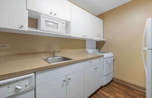 Full-size fridge, microwave, stovetop, dishwasher