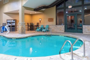 Indoor pool, pool umbrellas, sun loungers