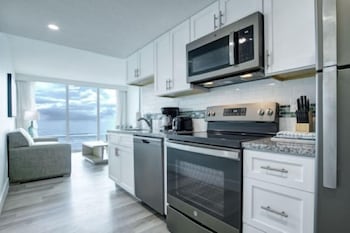 2 Bedroom, Ocean Front | Private kitchen | Full-size fridge, microwave, oven, stovetop at Grand Seas by Exploria Resorts