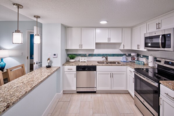 2 Bedroom Street View | Private kitchen | Full-sized fridge, microwave, oven, stovetop