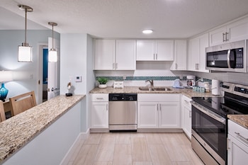 2 Bedroom Street View | Private kitchen | Full-size fridge, microwave, oven, stovetop at Grand Seas by Exploria Resorts
