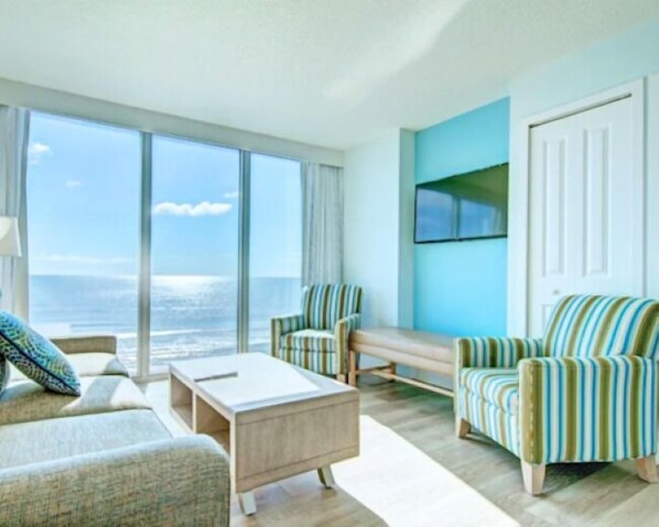 2 Bedroom, Ocean Front | Living area | Flat-screen TV - Grand Seas by Exploria Resorts (Daytona Beach)