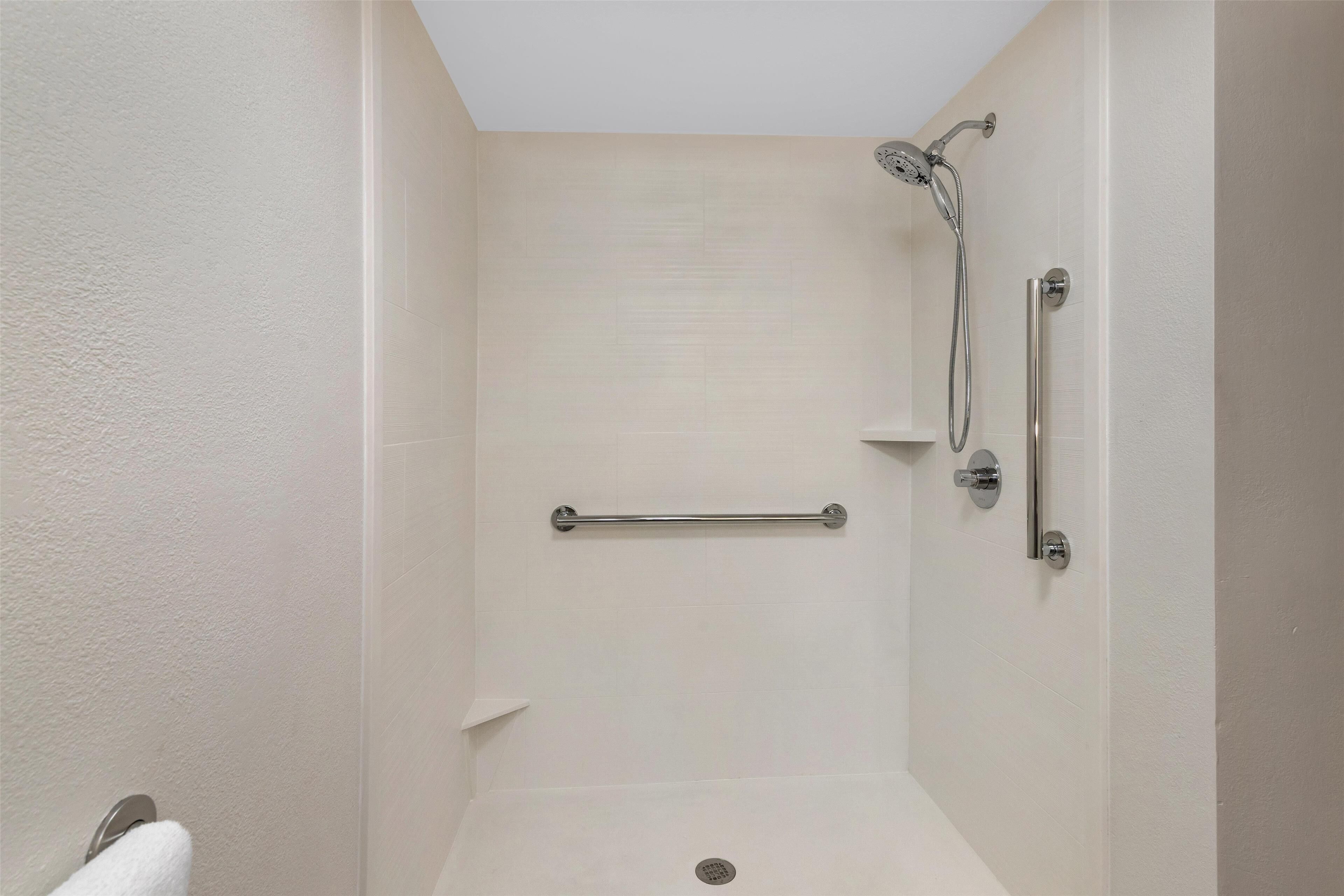 standard room, 1 king bed, accessible, refrigerator & microwave | bathroom | combined shower/bathtub, free toiletries, hair dryer, towels