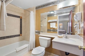 Two Queen Deluxe Room | Bathroom | Combined shower/tub, free toiletries, hair dryer, towels
