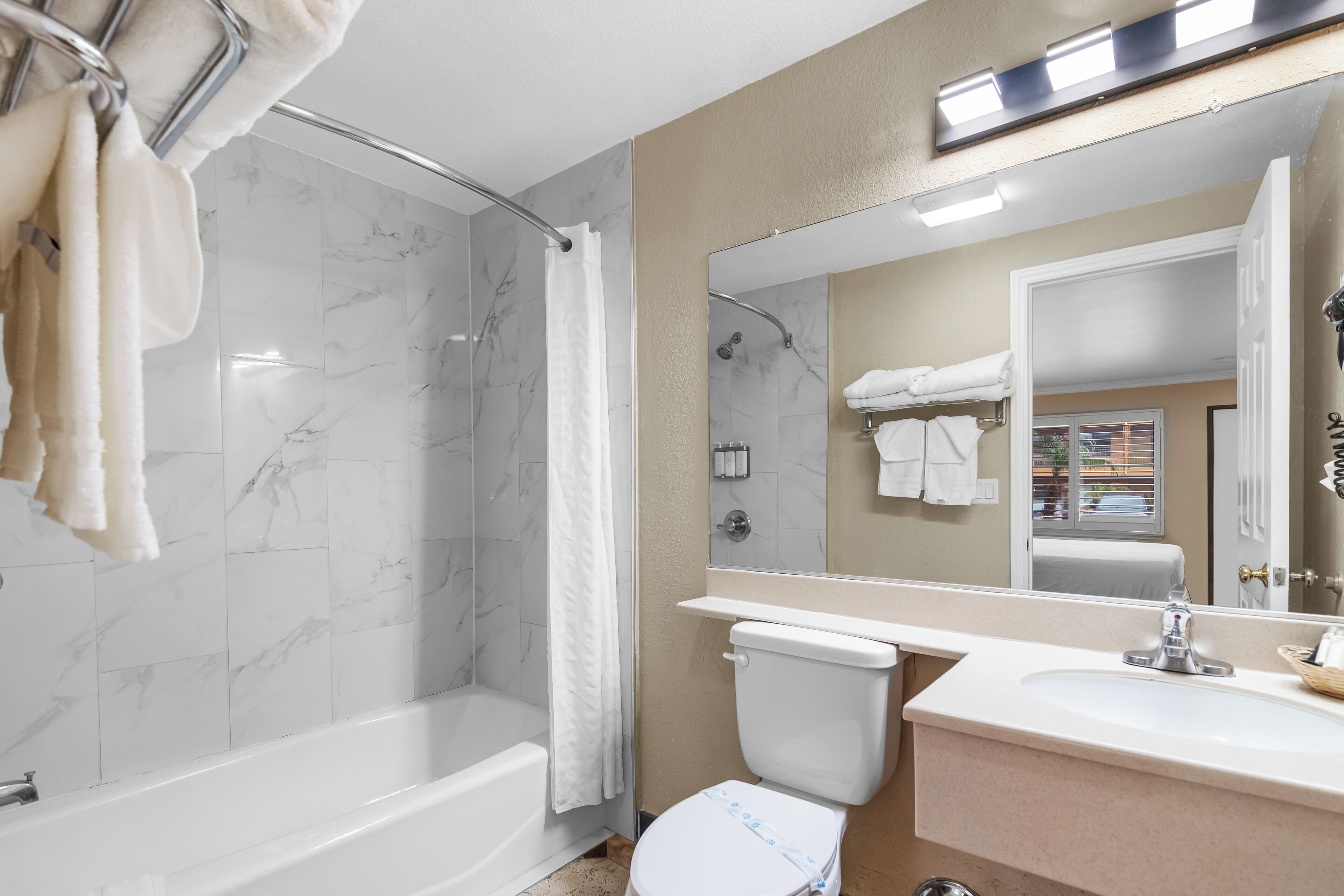 Queen Room with Two Queen Beds | Bathroom | Combined shower/tub, free toiletries, hair dryer, towels