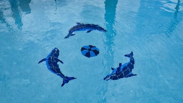 Seasonal outdoor pool, open 9:00 AM to 10:00 PM, pool umbrellas