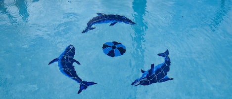 Seasonal outdoor pool, open 9:00 AM to 10:00 PM, pool umbrellas