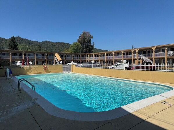 Outdoor pool, open 8:00 AM to 9:00 PM, pool umbrellas