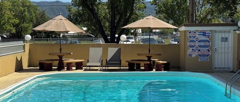 Outdoor pool, open 8:00 AM to 9:00 PM, pool umbrellas