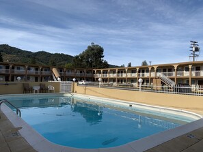 Outdoor pool, open 8:00 AM to 9:00 PM, pool umbrellas