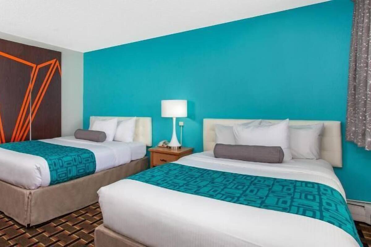 Premium bedding, desk, laptop workspace, blackout curtains