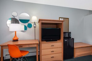 Premium bedding, desk, laptop workspace, blackout curtains