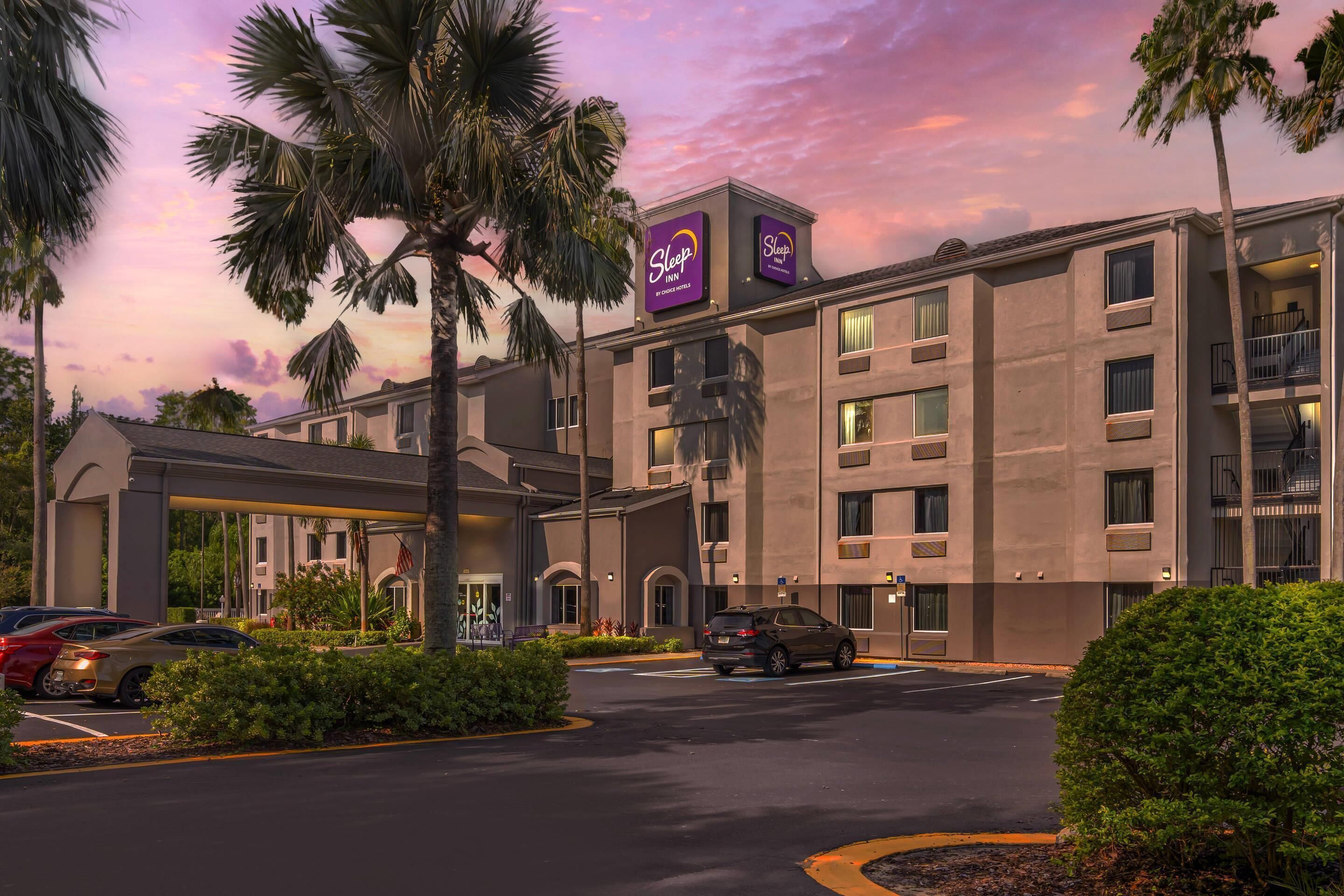 A hotel with a modern design, featuring a prominent Sleep In sign.